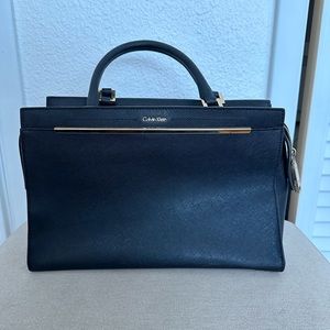 Calvin Klein black purse with gold accents